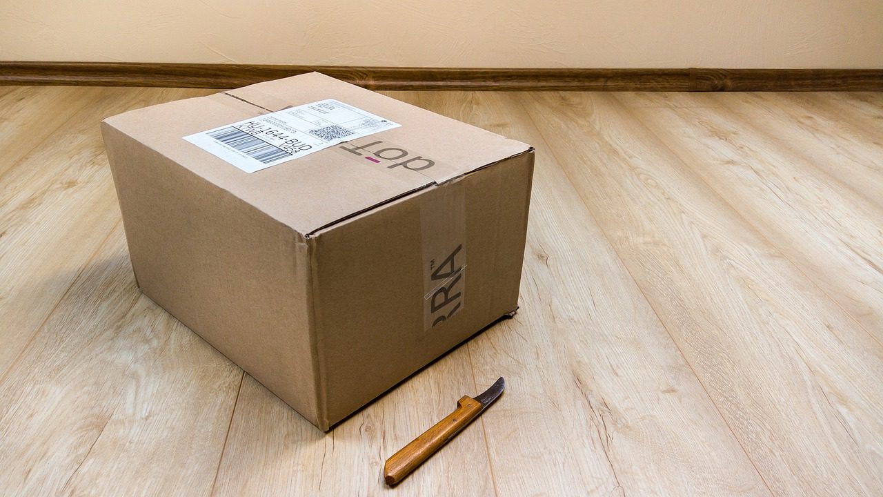 : a box and a knife on the floor