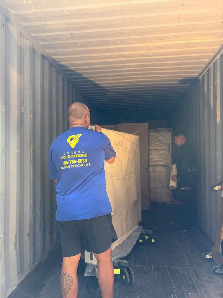 Full 20-foot shipping container packed with household goods for international relocation from Miami