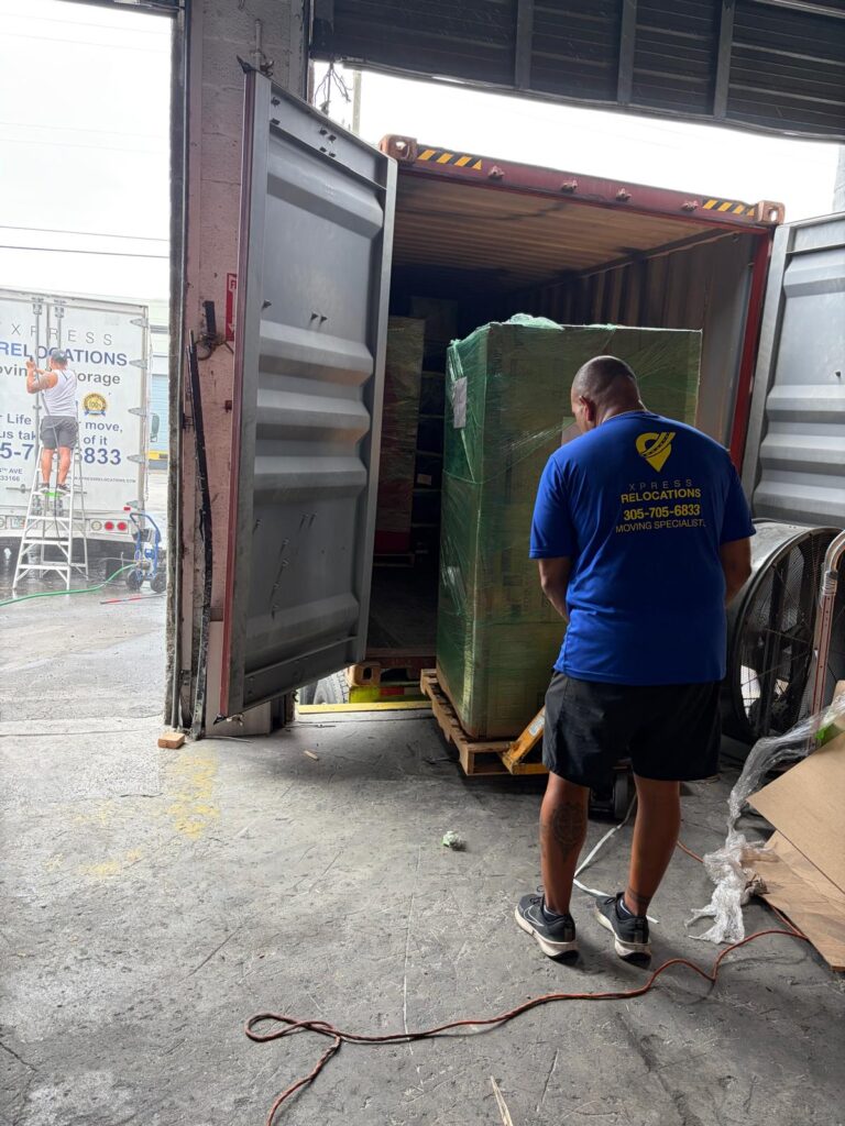 Xpress Relocations specialist preparing shipping container for international move from Miami to Spain
