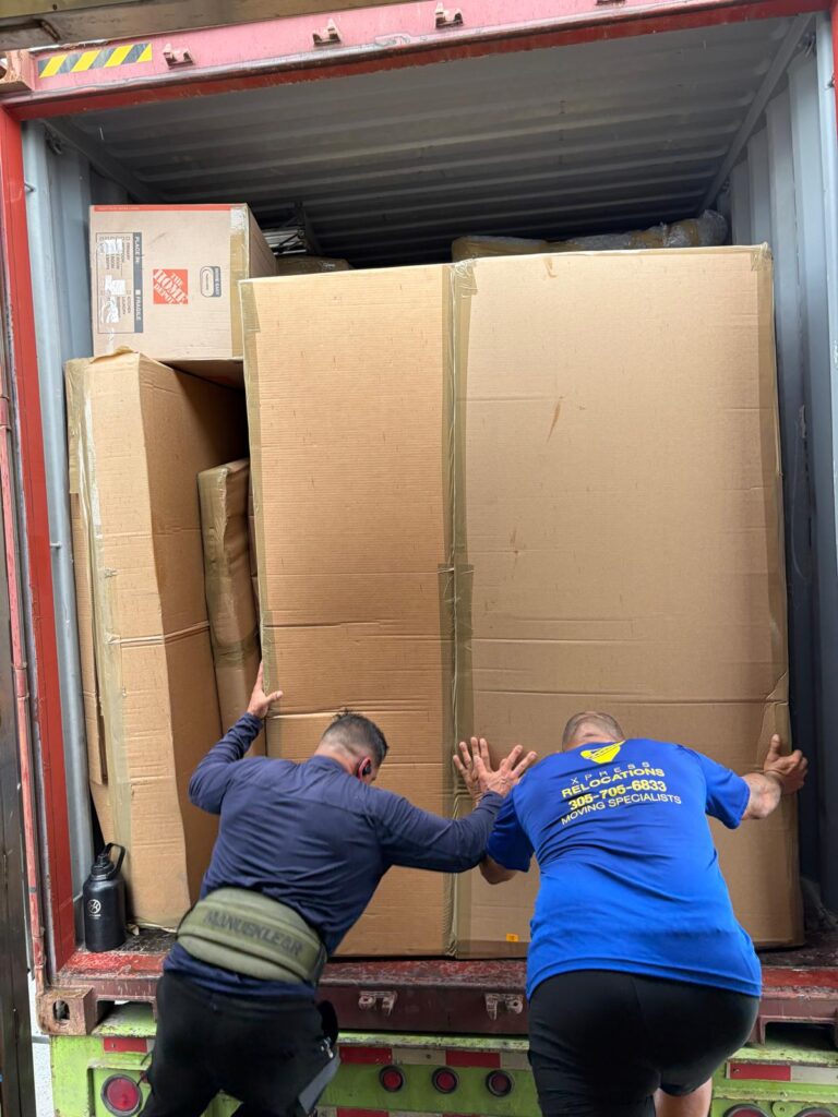 Xpress Relocations crew working directly on international shipment — licensed direct operator not a broker